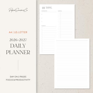 May include: A white daily planner with a minimalist design. The planner includes sections for top priorities, a schedule, and a to-do list. The text on the planner reads "A4 | US LETTER 2026-2027 DAILY PLANNER".