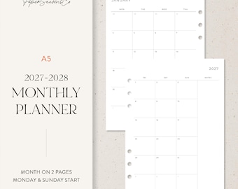 May include: An A5 2027-2028 monthly planner insert set with a month-on-two-pages layout. The white paper features black grid lines, Monday and Sunday start options, and the PaperSeasonsCo logo. The pages include pre-punched binder holes.