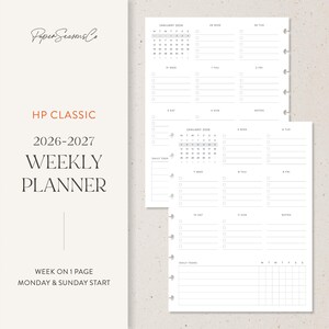 May include: A white weekly planner with the text "HP CLASSIC 2026-2027 WEEKLY PLANNER" in black and red. The planner includes a calendar and space for daily tasks. The planner is designed with a Monday & Sunday start.