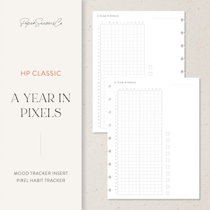 May include: White planner inserts with the text "A Year in Pixels" and "HP Classic". The inserts include a mood tracker and pixel habit tracker. The pages have a grid layout for tracking habits and moods.