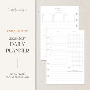 May include: A white daily planner insert with a minimalist design. The planner includes sections for top priorities, schedule, to-do list, exercise, meal planning, notes, water intake, and gratitude. Text on the planner reads "Personal Wide 2026-2027 Daily Planner."