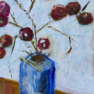 May include: An abstract painting of a blue vase holding branches with maroon-colored, round berries. The background is a textured white, and the vase sits on a brown surface. The artwork uses thick brushstrokes and a palette of blues, browns, and reds.