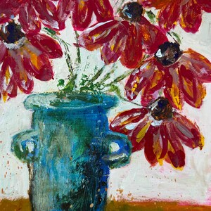May include: An abstract painting of a bouquet of red and yellow flowers in a blue vase. The vase has two handles and sits on a brown surface. The flowers have dark centers and are painted with visible brushstrokes.