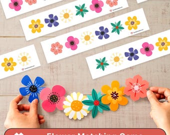 May include: A flower matching game with colorful, die-cut flower shapes and matching cards. The game features various flower designs in shades of pink, yellow, blue, and white. The text "Flower Matching Game" is displayed on a red banner.