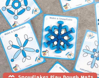 May include: Play dough mats with snowflake designs. The mats are white with blue snowflake outlines and the text "Make a Snowflake". Blue and white play dough is used to create the snowflakes. The image also includes a red banner that says "Snowflakes Play Dough Mats".