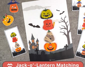 May include: A Halloween-themed matching game featuring colorful Jack-o'-Lanterns. The game includes a large card with a haunted house and graveyard scene, along with individual pumpkin cutouts and matching cards. The text "Jack-o'-Lantern Matching" is displayed.