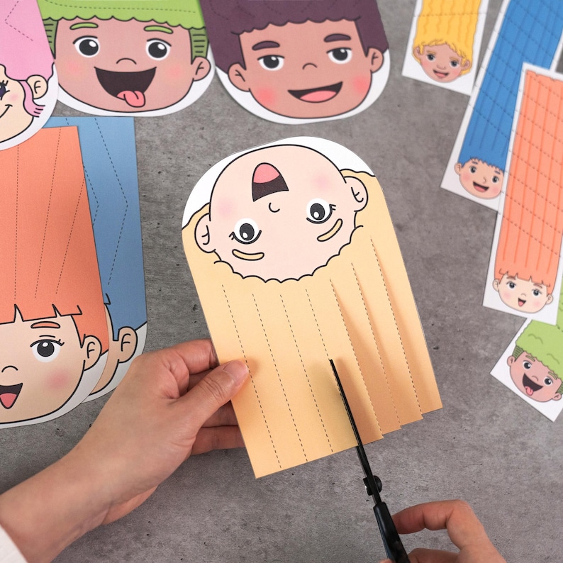 May include: A person's hand cutting the hair of a paper doll with scissors. The doll has a smiling face and yellow hair. Other paper dolls with different hair colors and facial expressions are scattered around.
