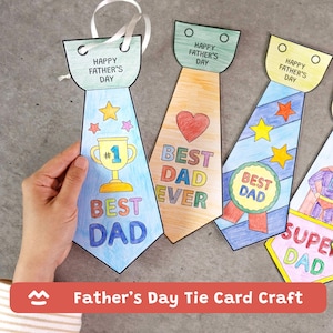 May include: Handmade Father's Day tie cards in various colors. Each card features the text "Happy Father's Day" and "Best Dad" or "Super Dad". Designs include a trophy, heart, and stars. White ribbon is attached for hanging.