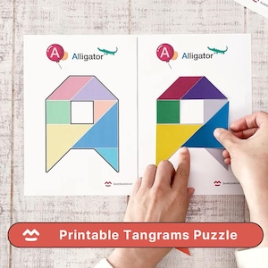 May include: Two white sheets with colorful tangram puzzles. One puzzle is complete, the other is being assembled. The text "A Alligator" and "Printable Tangrams Puzzle" are visible.