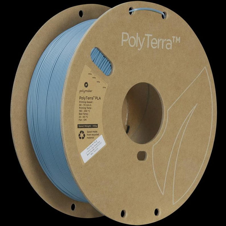 May include: A spool of light blue PolyTerra PLA filament for 3D printing. The spool is made of recycled material and has the PolyTerra logo printed on the side. The spool weight is 140g.