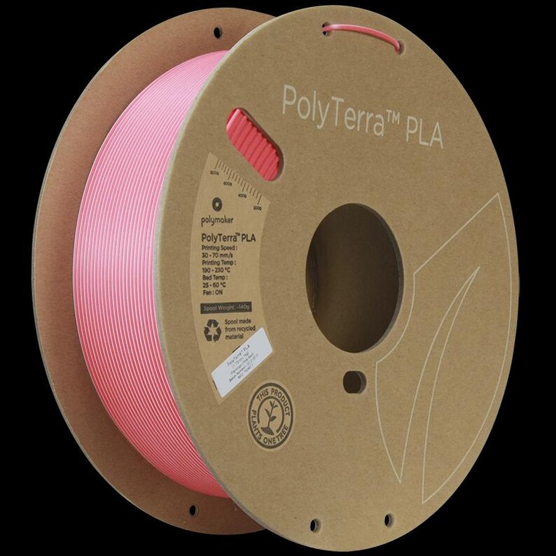May include: A spool of pink PolyTerra PLA 3D printing filament. The spool is made from recycled material and is labeled with printing specifications. The packaging is brown with white text and a circular logo that says "This product plants one tree."