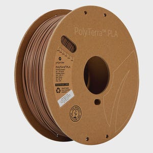 May include: A spool of PolyTerra PLA 3D printing filament in a warm brown color. The spool is made from recycled materials and has printed information on the side. The text "PolyTerra PLA" is visible on the cardboard spool.