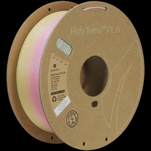 May include: A spool of PolyTerra PLA 3D printing filament. The filament is a gradient of yellow, pink, and white. The spool is made of brown cardboard and has printed text and a small window showing the filament color.