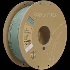 May include: A spool of PolyTerra PLA 3D printing filament in a muted green color. The spool is made of cardboard and features the PolyTerra PLA logo and product information. The text "THIS PRODUCT PLANTS ONE TREE" is also visible.