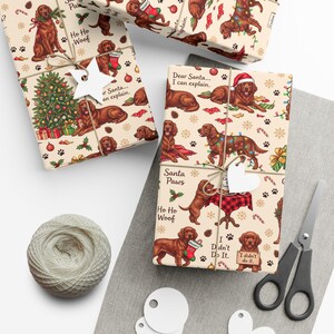 May include: Wrapping paper featuring illustrations of brown dogs in Christmas settings with text including Dear Santa I can explain, Santa Paws, Ho Ho Woof, and I didn't do it. The pattern includes Christmas trees, stockings, and candy canes.