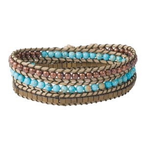 May include: A multi-layered bracelet with brown leather cord, copper beads, and turquoise beads.