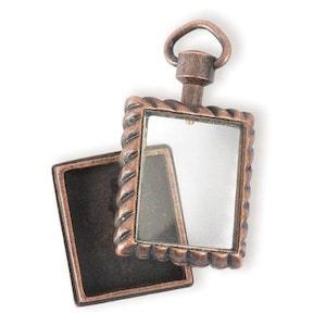 May include: A small, antique-style, copper-toned locket with a hinged lid and a clear glass window. The locket has a rope-like design around the edge and a loop at the top for hanging.