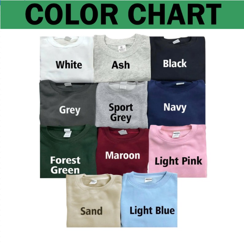 May include: A color chart displaying eleven crewneck sweatshirts in various colors labeled White, Ash, Black, Grey, Sport Grey, Navy, Forest Green, Maroon, Light Pink, Sand, and Light Blue. Each sweatshirt features a visible brand tag at the neck.
