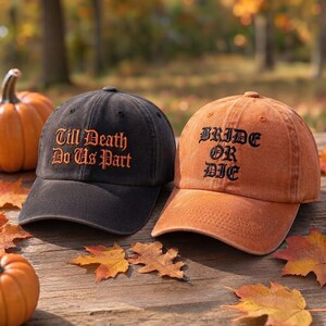 May include: A black baseball cap with orange embroidered text reading Till Death Do Us Part and an orange baseball cap with black embroidered text reading BRIDE OR DIE, both featuring a curved brim and a structured six-panel crown design.