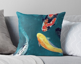 May include: A teal blue background with three koi fish swimming. One fish is red, white, and black. The other two fish are yellow and white.