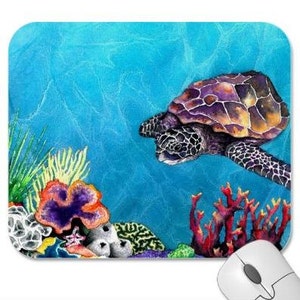 May include: A watercolour painting of a sea turtle swimming in blue water with coral reefs and seaweed. The turtle has a purple and brown shell and is swimming towards the right side of the image.