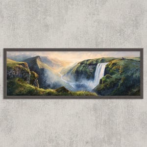 May include: A framed landscape painting depicts a waterfall cascading down a lush green hillside. The artwork features a river winding through a valley, with mountains in the background. The color palette includes greens, blues, and browns.