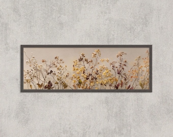 May include: A framed botanical print featuring dried flowers in shades of yellow, brown, and beige. The artwork is set against a neutral background and framed in a dark brown rectangular frame. The image is mounted on a textured, light gray wall.