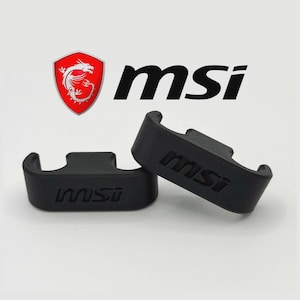 May include: Two black, curved brackets with the MSI logo imprinted on them. The MSI logo is also displayed above the brackets, featuring a red shield with a white dragon and the letters "msi" in black.