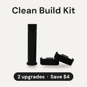 May include: A black Clean Build Kit featuring a cylindrical tool with a textured top and two curved components. The text Clean Build Kit is displayed at the top, and the text 2 upgrades · Save $4 is displayed at the bottom of the image.