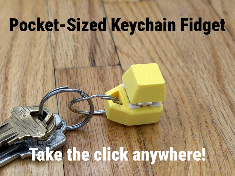 K&ouml;nnte beinhalten: Ein gelber, taschengro&szlig;er Schl&uuml;sselanh&auml;nger-Fidget mit einem Tastenkappendesign, befestigt an einem Schl&uuml;sselring mit Schl&uuml;sseln. Der Text "Pocket-Sized Keychain Fidget" und "Take the click anywhere!" sind sichtbar.