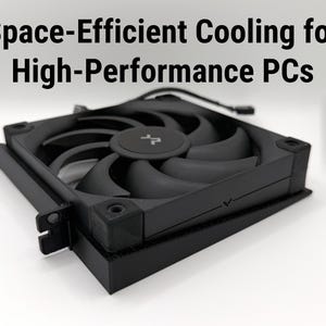 May include: Black computer fan with curved blades and a central hub. The fan is designed for high-performance PCs and is labeled "Space-Efficient Cooling for High-Performance PCs". The fan is made of black plastic and has a square shape.