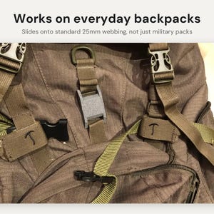 May include: A brown backpack featuring olive green webbing straps, plastic side-release buckles, and a grey plastic attachment clip. Text at the top reads: Works on everyday backpacks. Slides onto standard 25mm webbing, not just military packs.