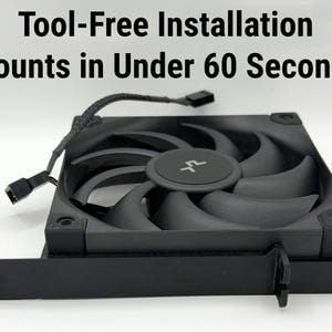 May include: A black computer fan with curved blades and a central hub. The fan has a square frame and a connector cable. Text on the image reads: "Tool-Free Installation Mounts in Under 60 Seconds."