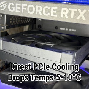May include: Close-up of a computer component with the text "GEFORCE RTX" visible. A black fan is installed below the text. The text "Direct PCIe Cooling Drops Temps 5-10&deg;C" is also visible.