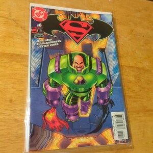 May include: A comic book featuring Superman and Batman, with a cover illustration of Lex Luthor in a green and purple suit. The DC Comics logo is visible, along with the title and issue number.