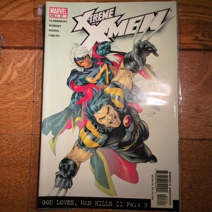 May include: A comic book cover for X-Treme X-Men, featuring Wolverine and Storm in action poses. The cover has the Marvel logo and the text "GOD LOVES, MAN KILLS II Part 3". The comic is in a protective sleeve.