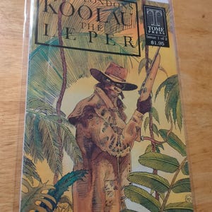 May include: Comic book cover for "Koolau the Leper" by Jack London. The illustration features a figure in a hat and coat holding a rifle, set against a jungle backdrop. The Tome Press logo is visible.