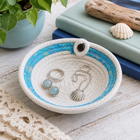 A coiled rope basket with a real Lake Superior agate tucked in — earthy, tactile, and genuinely one-of-a-kind since every agate is unique.