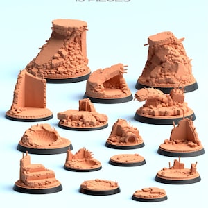 May include: A collection of 15 miniature terrain pieces depicting destroyed city bases. The pieces are a reddish-brown color and feature detailed rubble and architectural fragments. The bases are round and black. The text "Scenery Terrain DESTROYED CITY BASES 15 PIECES" is at the top.