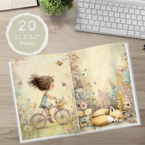 May include: Open notebook with a whimsical illustration of a girl cycling through a field of flowers, with a sleeping fox. The notebook has 20 pages and measures 27.9 x 21.6 cm. The pages are lined.