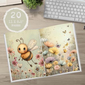 May include: Open journal featuring a bee and floral illustration. The journal has 20 pages and measures 28 x 21.6 cm. The pages have a lined design with butterflies and flowers.