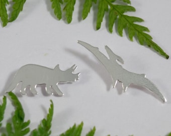 Silver Dinosaur earrings: A pair of Triceratops and Pterodactyl shaped eco silver earrings.