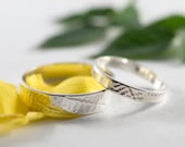 Fern frond Wedding Bands: A Set of his and hers recycled sterling silver fern frond textured wedding rings