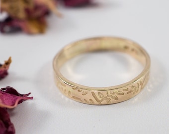 Gold Botanical Wedding Bands: A hers and hers set of 14ct yellow recycled gold textured wedding ring bands