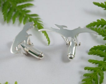 Silver Dinosaur cufflinks: A pair of T Rex and Pterodactyl eco silver cufflinks.