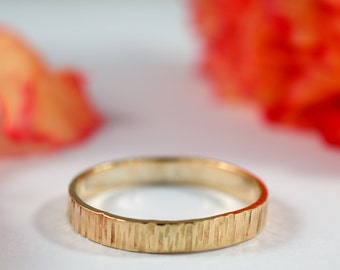 Gold Bark Wedding Band: A hers and hers pair of 9ct yellow recycled gold textured wedding bands