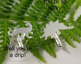 Silver Dinosaur cufflinks: A pair of Dryptosaurus and Stegosaurus sterling silver cufflinks.