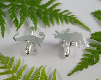 Silver Dinosaur cufflinks: A pair of Dryptosaurus and Triceratops shaped recycled sterling silver cufflinks.