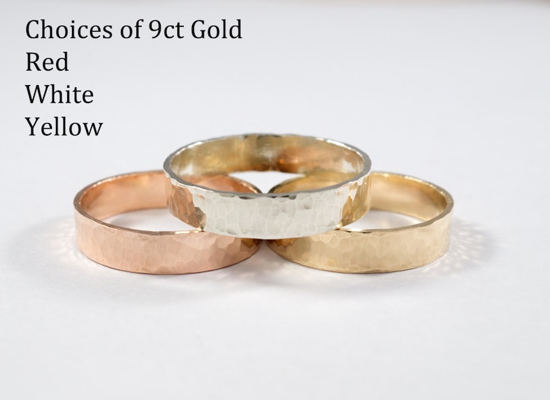 May include: Three 9ct gold rings in yellow, white, and red gold. The rings are hammered and have a textured finish.