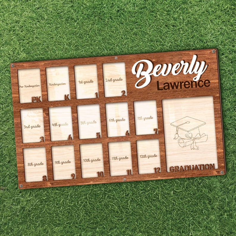 May include: A wooden graduation photo display board with spaces for photos from pre-kindergarten through 12th grade. The board is engraved with the name "Beverly Lawrence" and a graduation cap graphic. The word "GRADUATION" is also engraved.